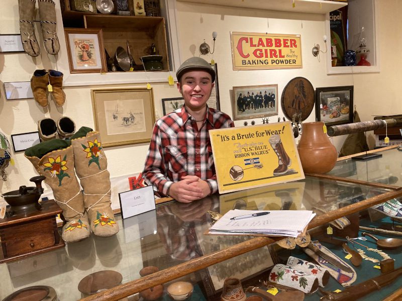 Thomas Coronato, proprietor of the Black Hills Curio Company at 517 State Street with some of the Native American artifacts available in the store.